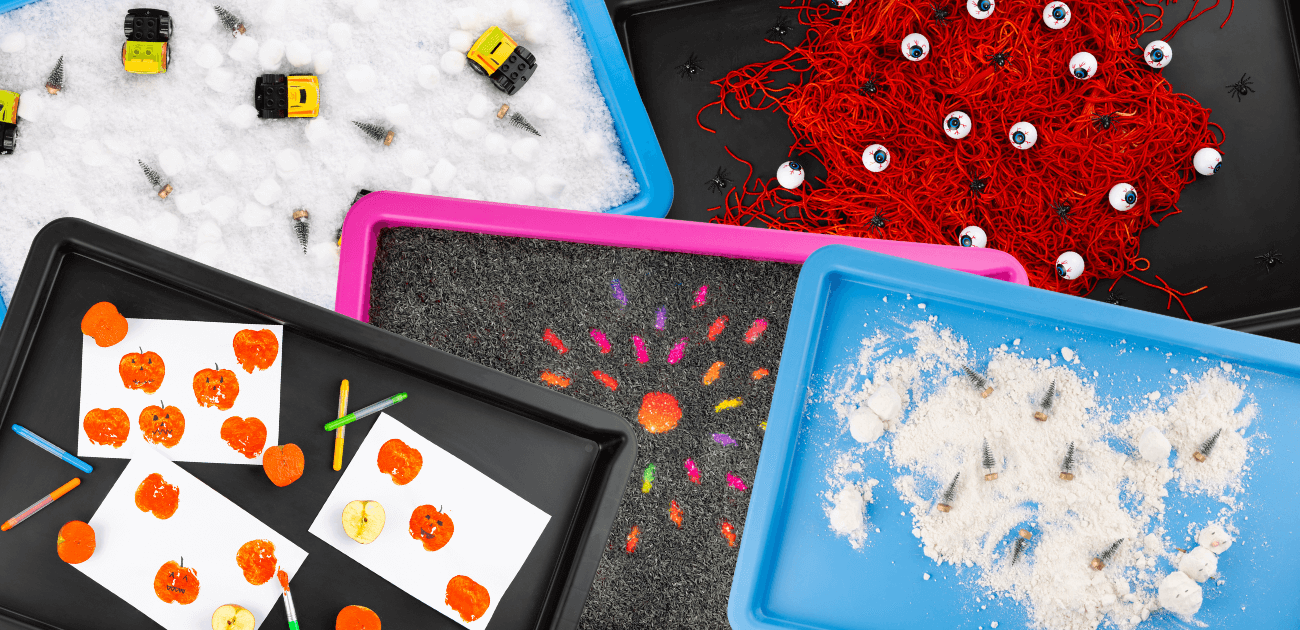 Autumn and winter sensory play tray setups with seasonal textures and colours for kids.