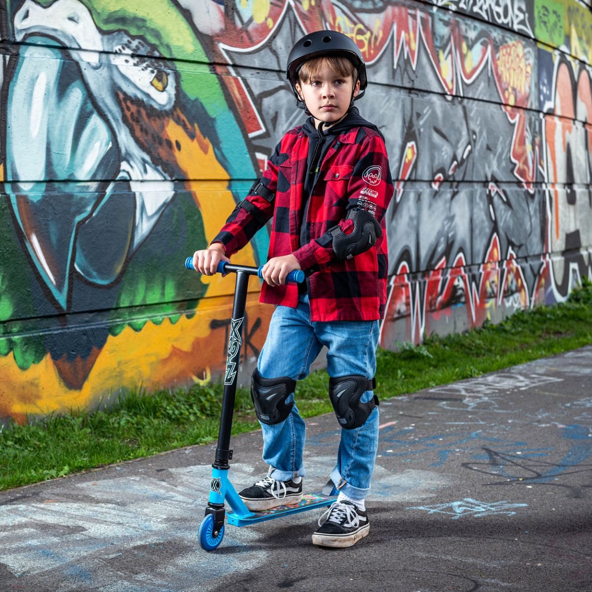 Monster Mash Up stunt scooter for kids with blue wheels and graphic deck
