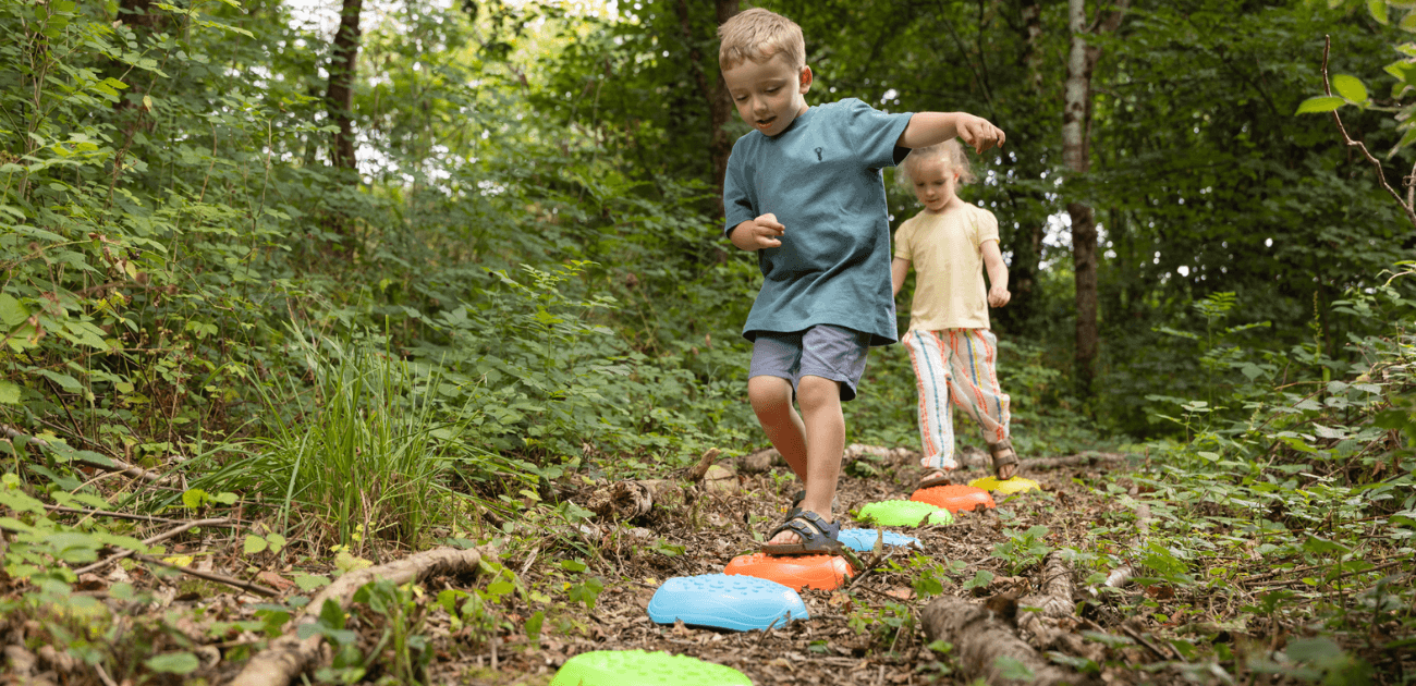 Children playing with the Toyrific Stepping Stones balancing game to build balance and confidence.